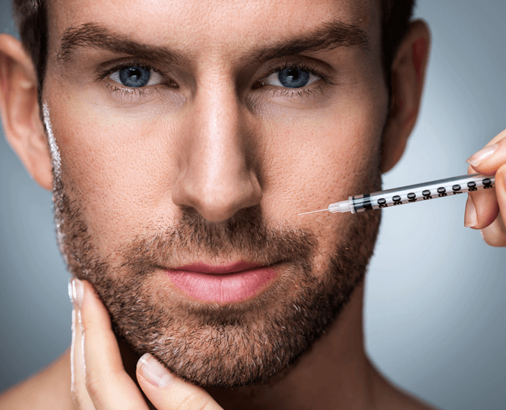 bearded man getting facial dermal filler